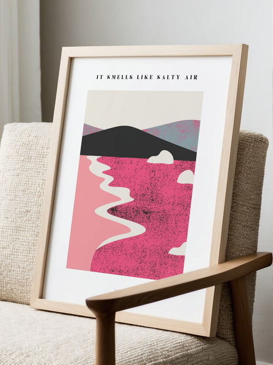 Abstract coastal landscape art print with layered pink hills, winding cream, displayed in modern living room setting