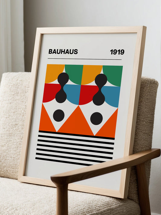Bauhaus 1919 geometric poster featuring symmetrical composition with orange, displayed in modern living room setting