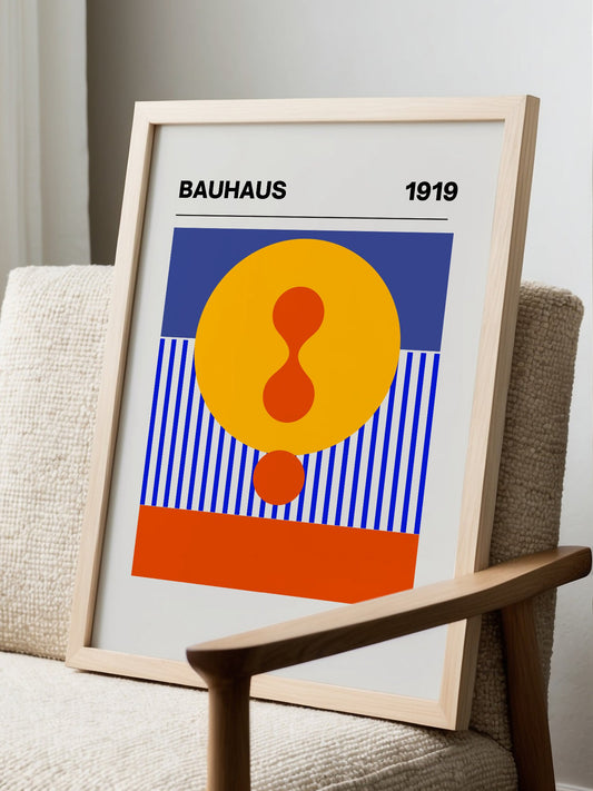 Bauhaus 1919 geometric poster featuring yellow circle with red hourglass shape, displayed in modern living room setting
