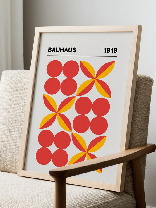 Bauhaus 1919 geometric art print with red circles and yellow pinwheel shapes in, displayed in modern living room setting