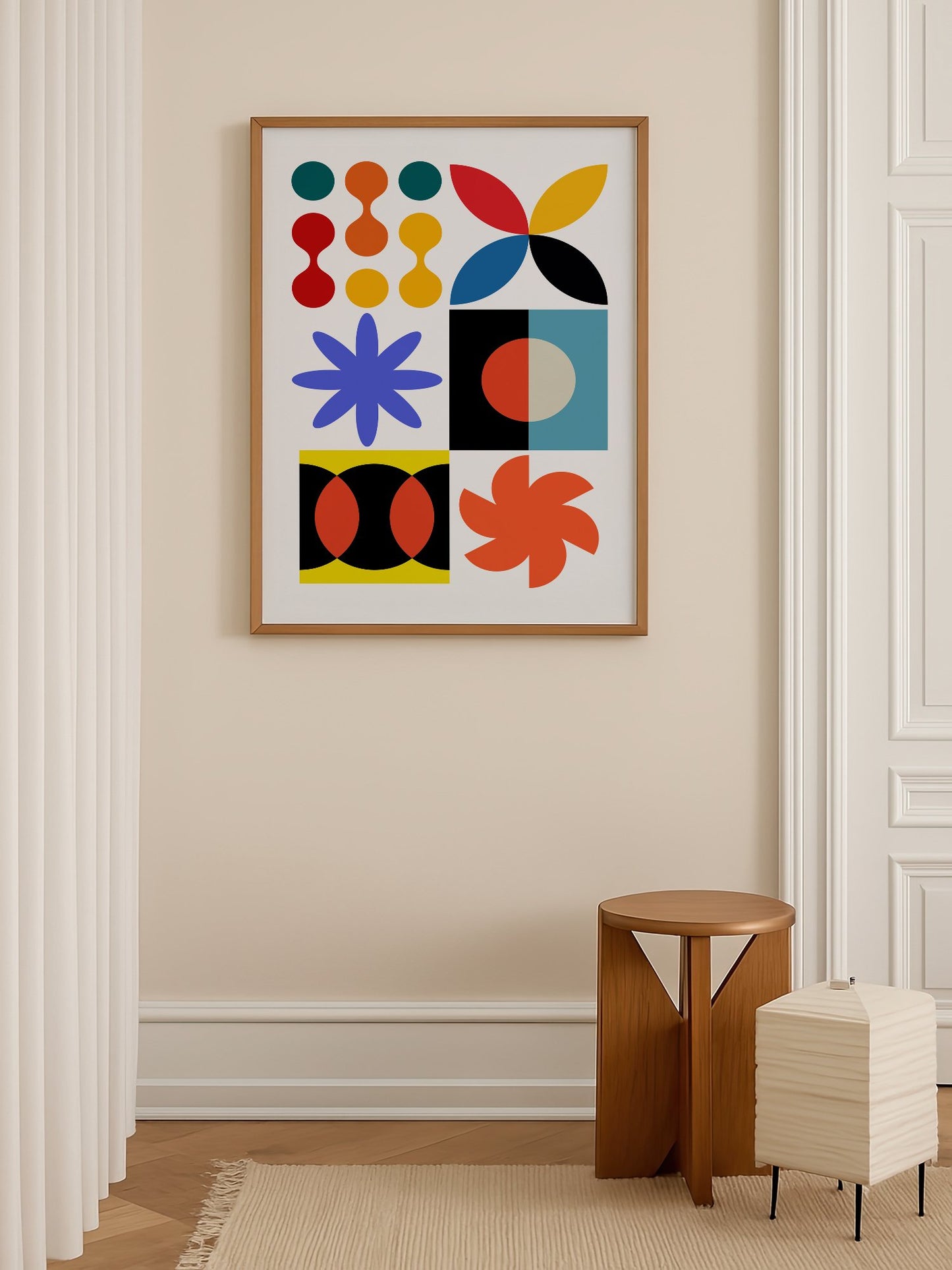Colourful geometric abstract art print with starbursts, circles and shapes in, shown in minimalist home office space