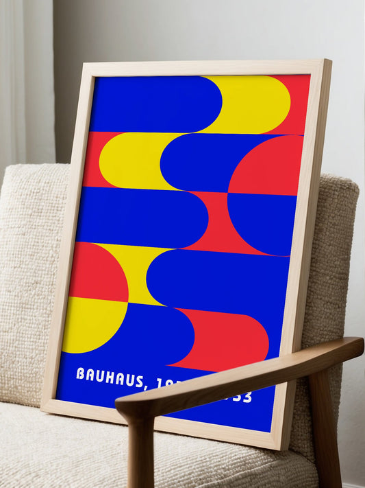 Bauhaus geometric abstract poster with interlocking blue yellow and red shapes, displayed in modern living room setting