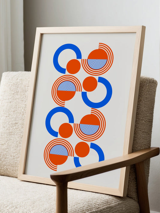 Abstract Bauhaus wall art print with interlocking blue and orange concentric, displayed in modern living room setting