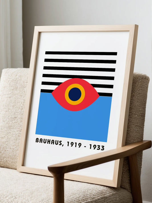 Bauhaus geometric eye poster with concentric red yellow and blue circles, displayed in modern living room setting