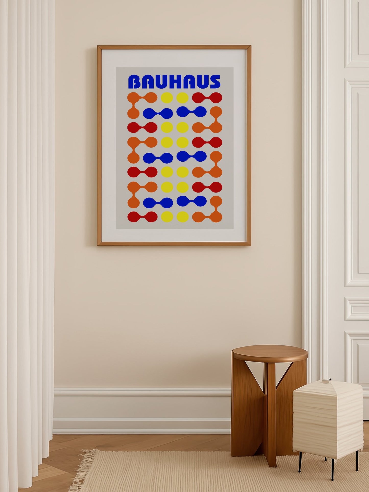 Bauhaus poster with bold blue typography and geometric grid pattern of circles, shown in minimalist home office space