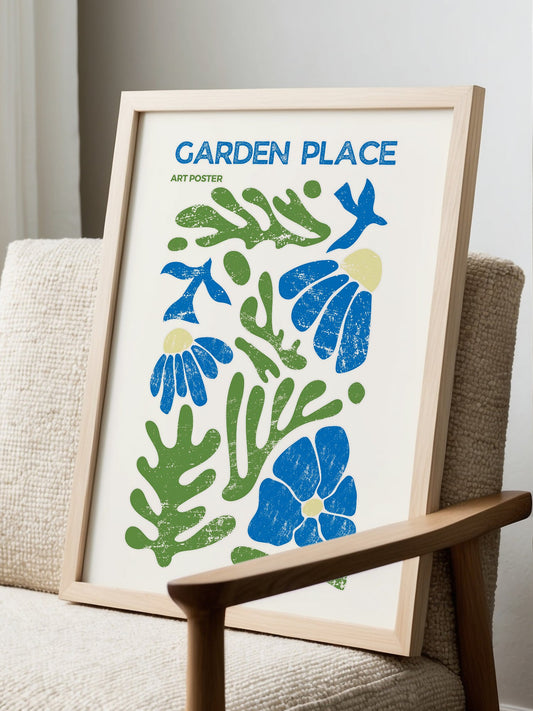 Garden Place botanical art poster with abstract blue flowers and green leaves, displayed in modern living room setting