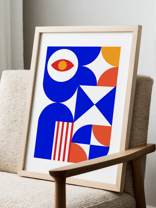 Geometric abstract art print with red eye motif, blue background, coral and, displayed in modern living room setting