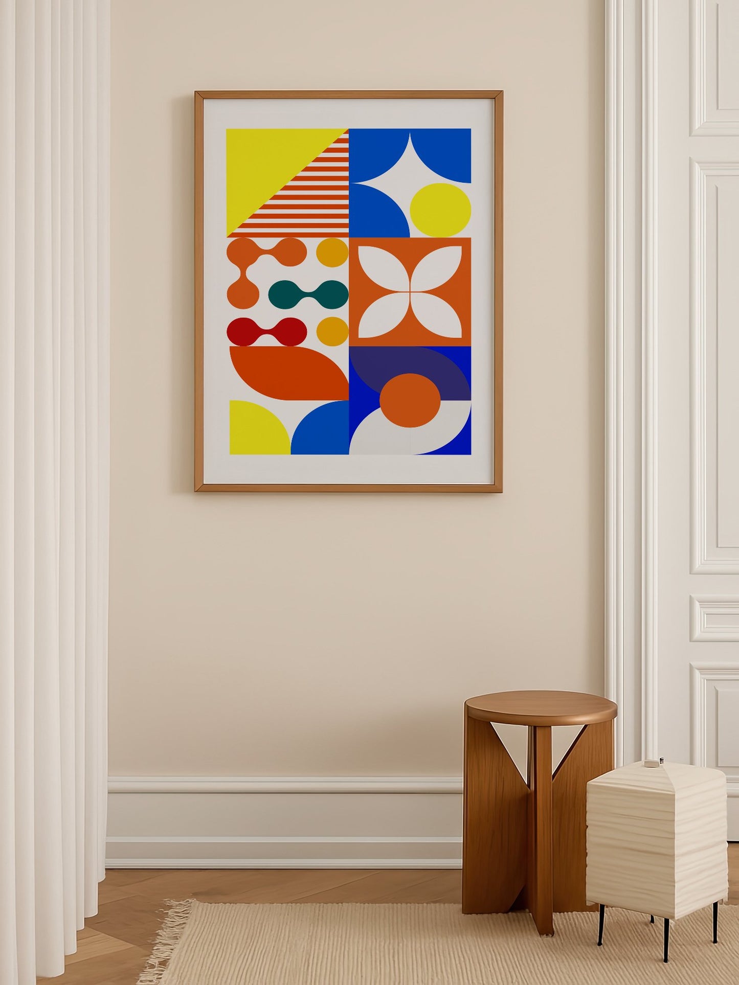 Geometric abstract wall art with bold blue curves, orange circles, yellow, shown in minimalist home office space