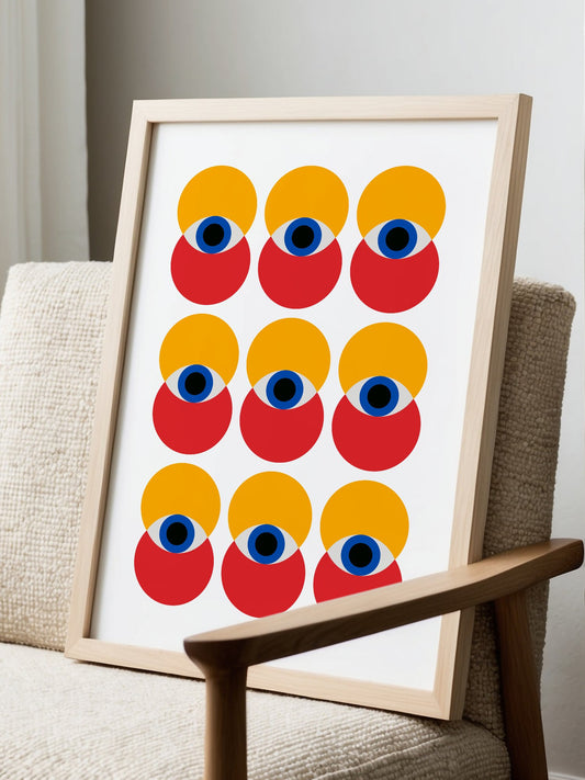 Nine stylized geometric faces in grid pattern with yellow circles, red shapes, displayed in modern living room setting