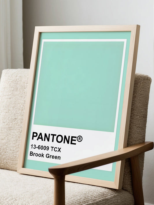 Minimalist solid color wall art print in Pantone Brook Green 13-6009 TCX, displayed in modern living room setting
