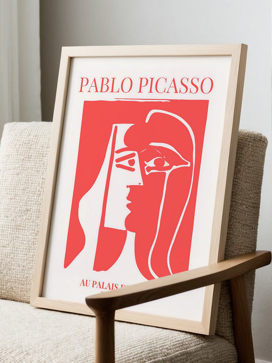 Pablo Picasso Red Kiss cubist portrait print featuring stylized female profile, displayed in modern living room setting