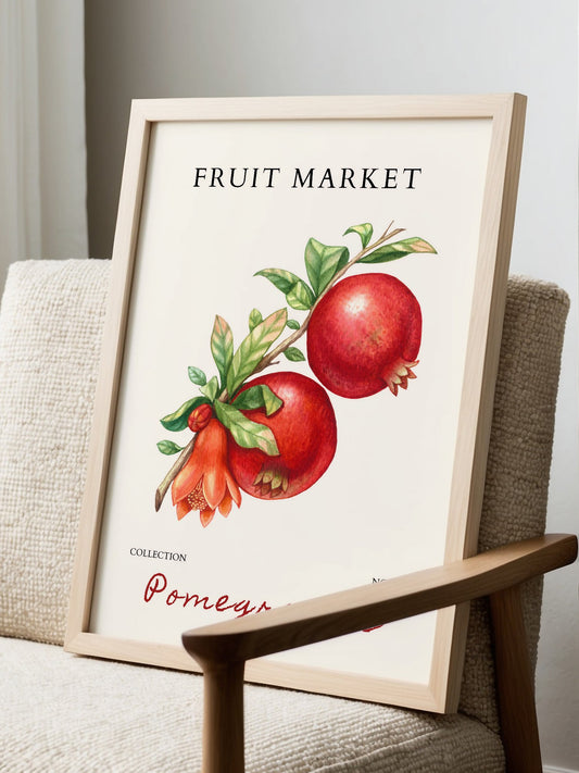 Botanical illustration of red pomegranates on branch with orange flowers and, displayed in modern living room setting