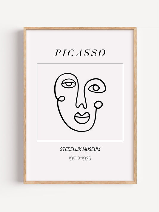 Abstract Picasso face art print featuring minimalist black line drawing on, close-up showing print texture and color detail