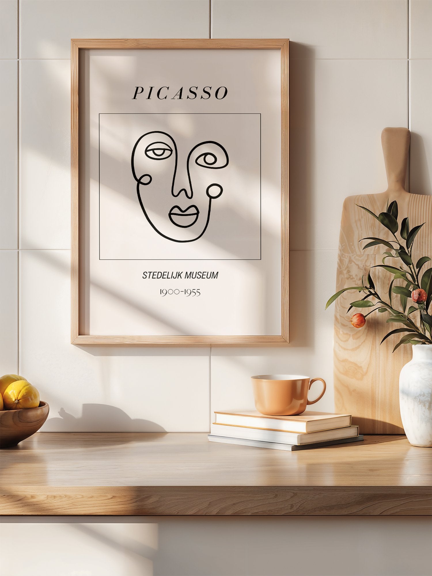 Abstract Picasso face art print featuring minimalist black line drawing on, hanging in contemporary bedroom interior