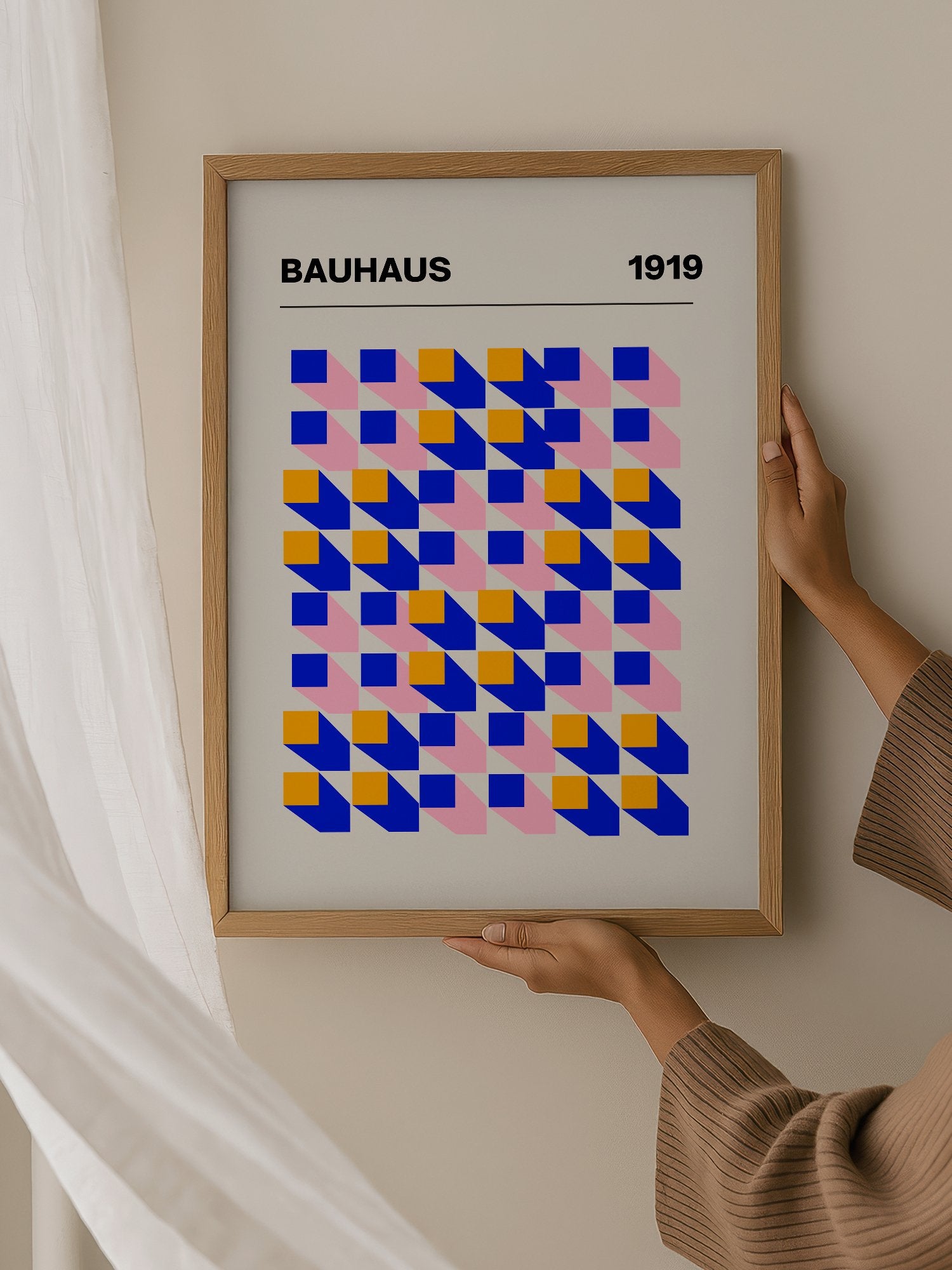 Bauhaus 1919 geometric abstract art print with interlocking blue yellow and, hanging in contemporary bedroom interior