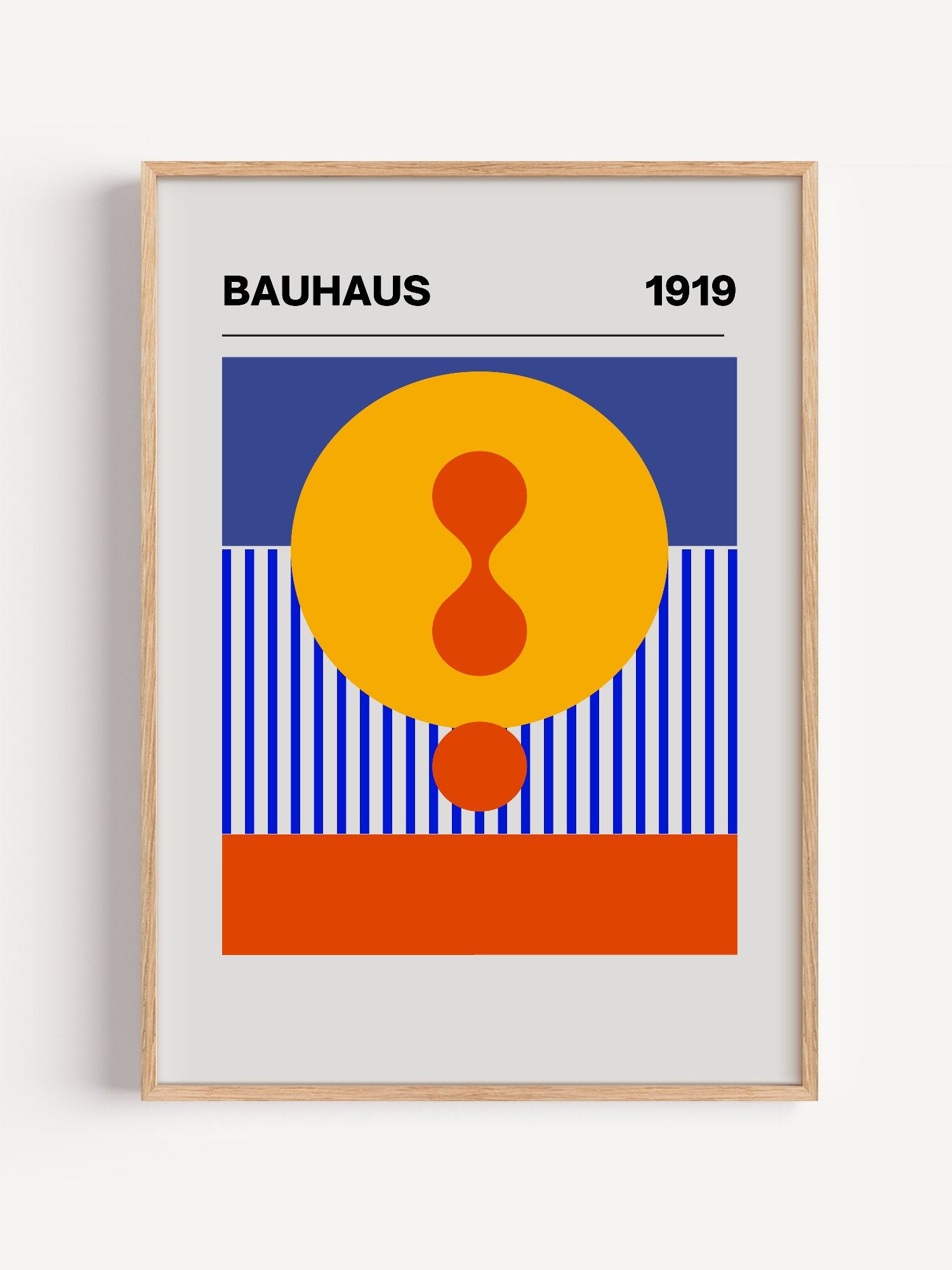 Bauhaus 1919 geometric poster featuring yellow circle with red hourglass shape, close-up showing print texture and color d...