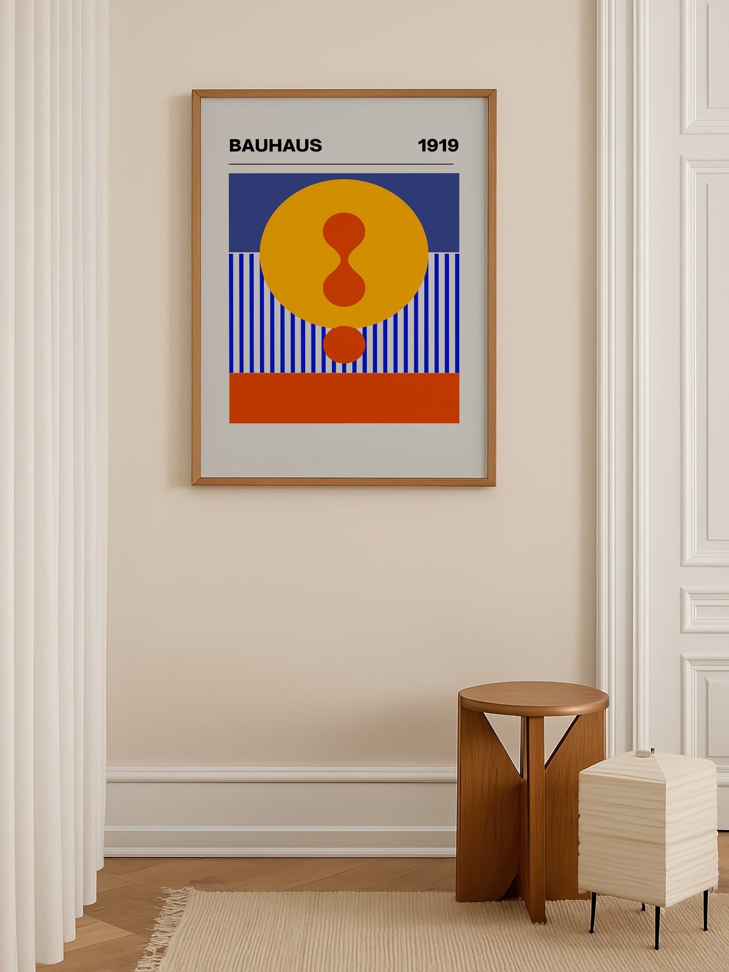 Bauhaus 1919 geometric poster featuring yellow circle with red hourglass shape, shown in minimalist home office space