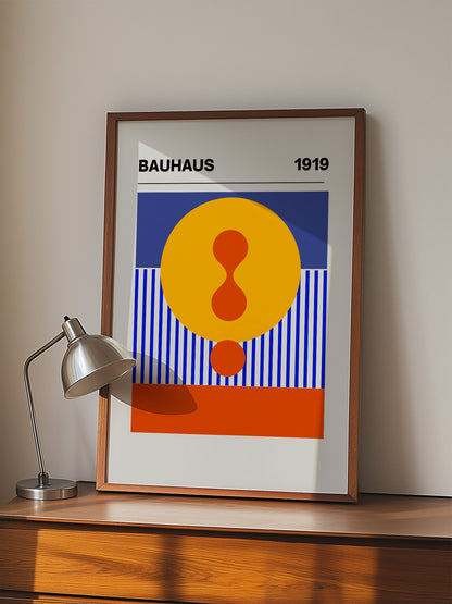 Bauhaus 1919 geometric poster featuring yellow circle with red hourglass shape, displayed in modern living room setting