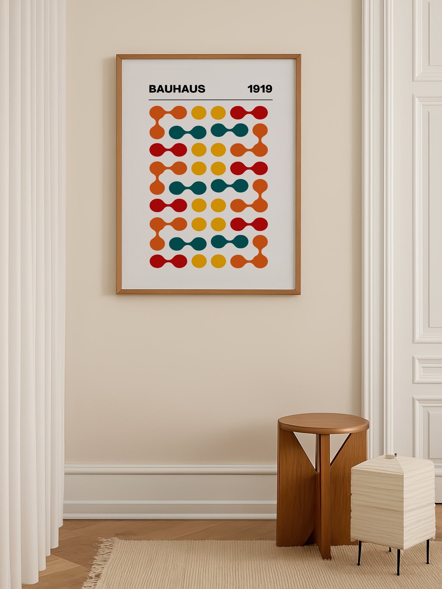 Bauhaus 1919 geometric wall art print featuring orange teal yellow and red, shown in minimalist home office space