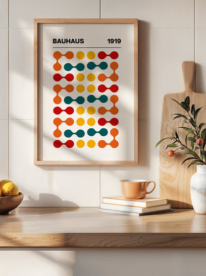 Bauhaus 1919 geometric wall art print featuring orange teal yellow and red, hanging in contemporary bedroom interior