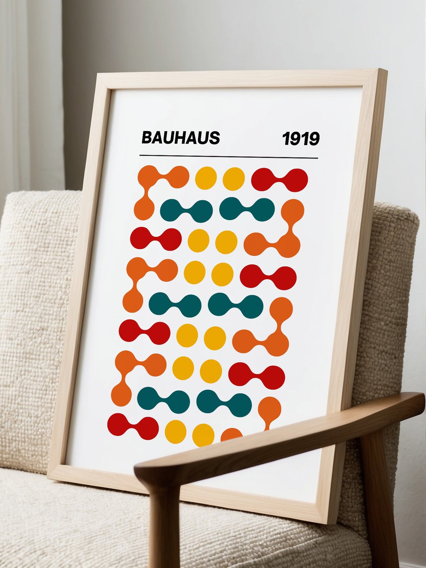 Bauhaus 1919 geometric wall art print featuring orange teal yellow and red, displayed in modern living room setting
