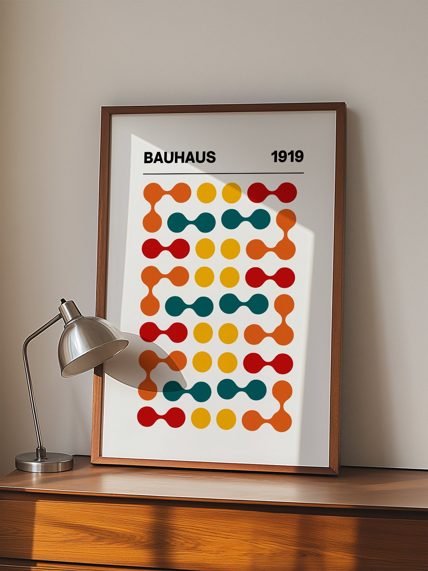 Bauhaus 1919 geometric wall art print featuring orange teal yellow and red, displayed in modern living room setting