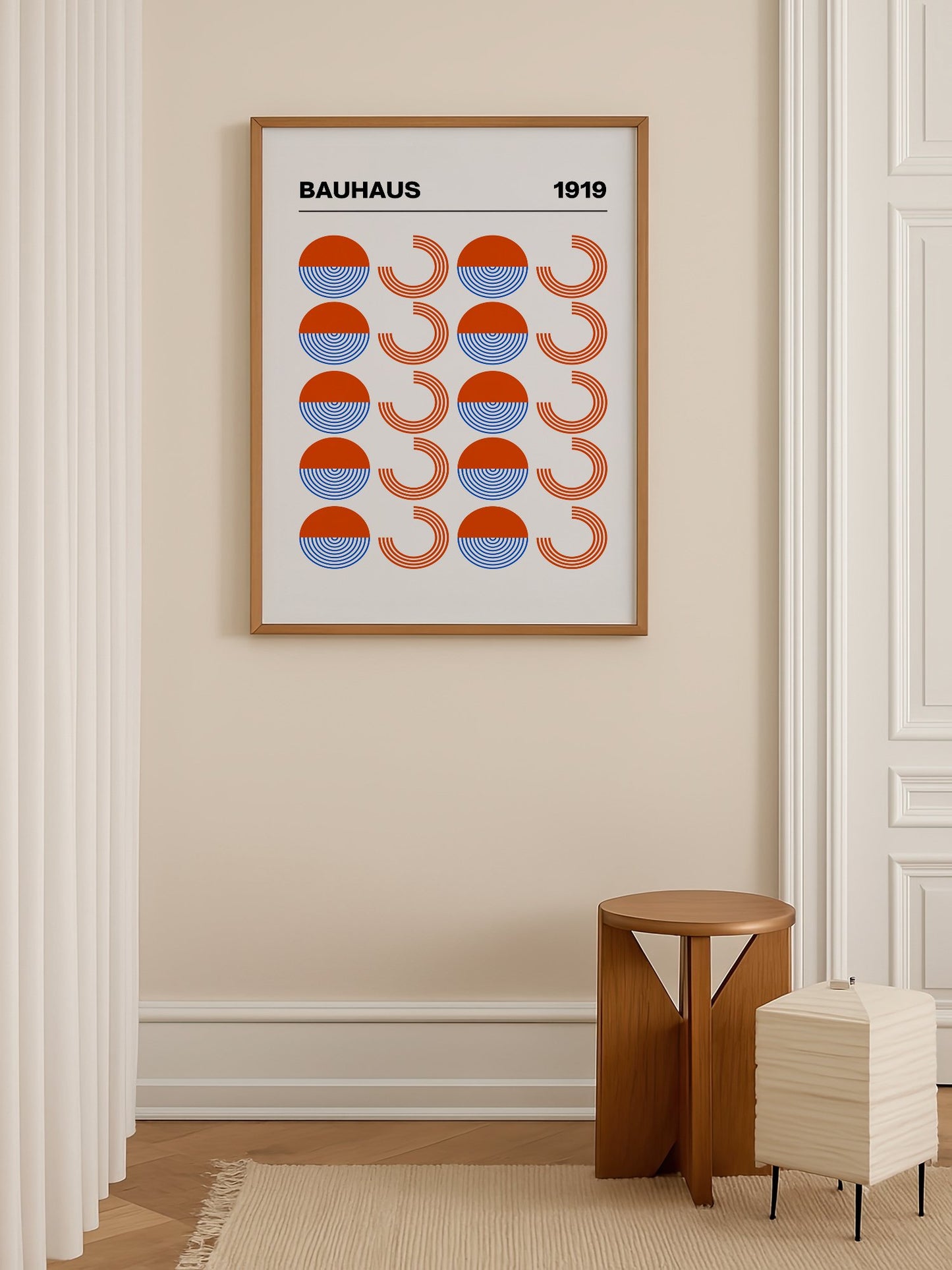 Bauhaus 1919 geometric poster featuring grid pattern of orange and blue, shown in minimalist home office space