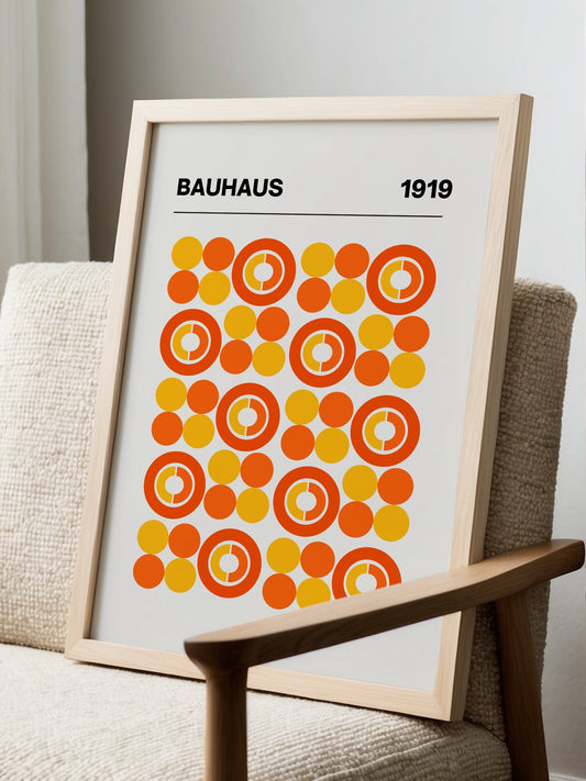 Bauhaus 1919 geometric poster featuring grid of orange and yellow concentric, displayed in modern living room setting