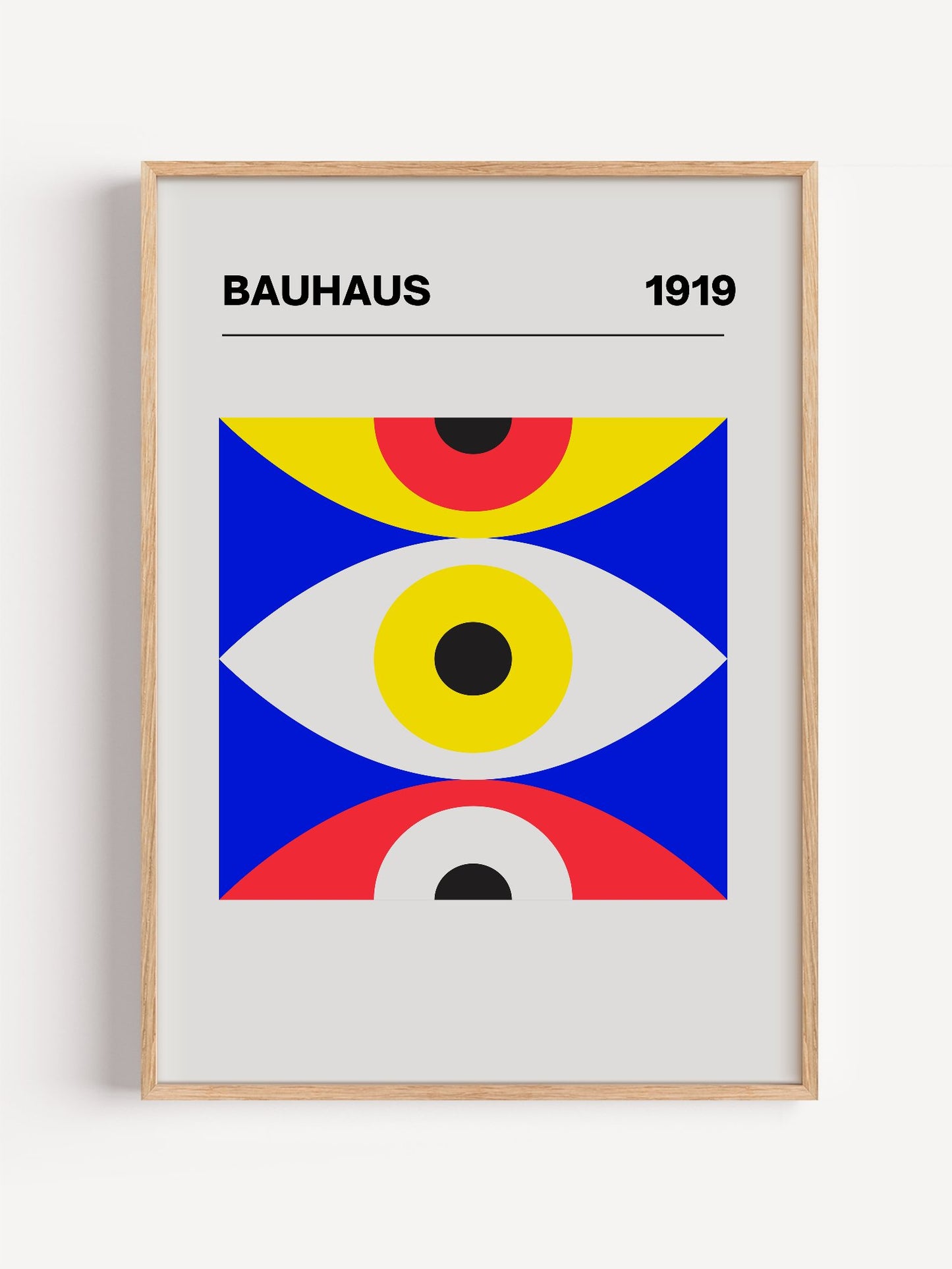 Bauhaus 1919 geometric poster with three stacked eye shapes in yellow red and, close-up showing print texture and color de...