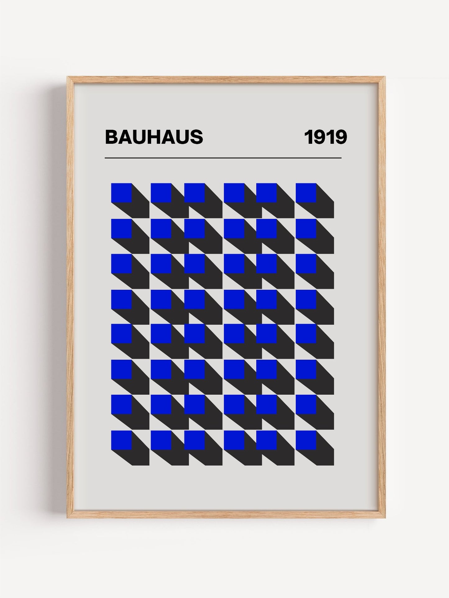 Bauhaus 1919 geometric poster featuring blue isometric cubes arranged in grid, close-up showing print texture and color de...