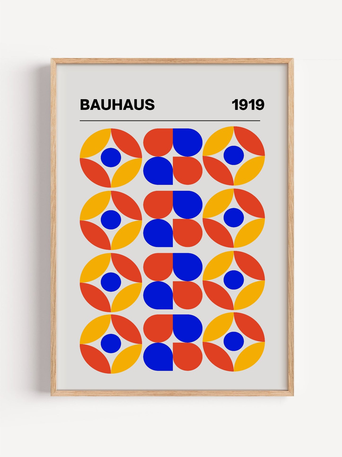 Bauhaus 1919 geometric poster featuring circular medallions in blue red yellow, close-up showing print texture and color d...