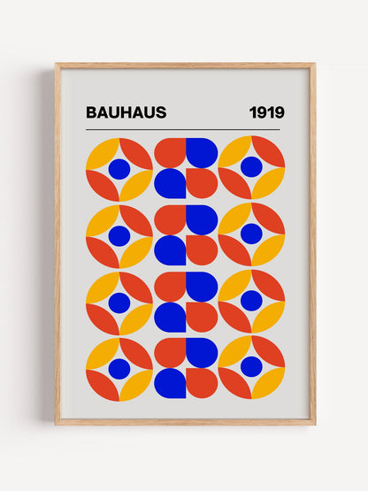 Bauhaus 1919 geometric poster featuring circular medallions in blue red yellow, close-up showing print texture and color d...