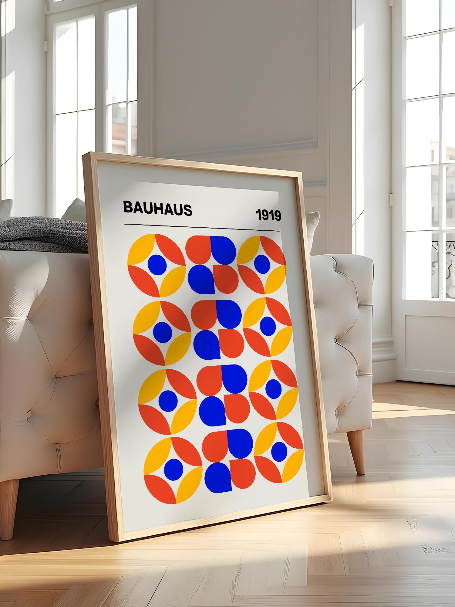 Bauhaus 1919 geometric poster featuring circular medallions in blue red yellow, featured in stylish apartment decor