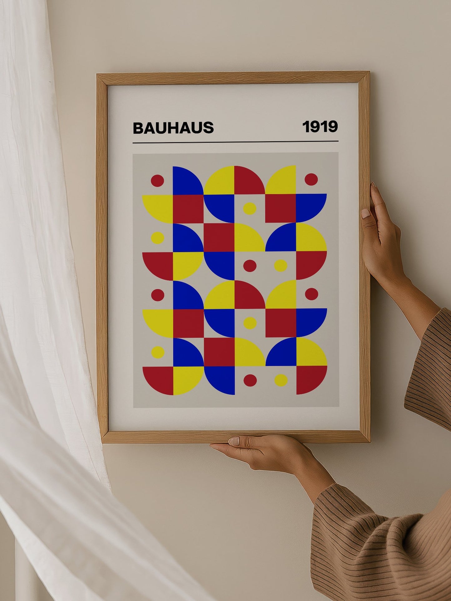 Bauhaus geometric wall art with red blue yellow grid pattern, semicircular, hanging in contemporary bedroom interior