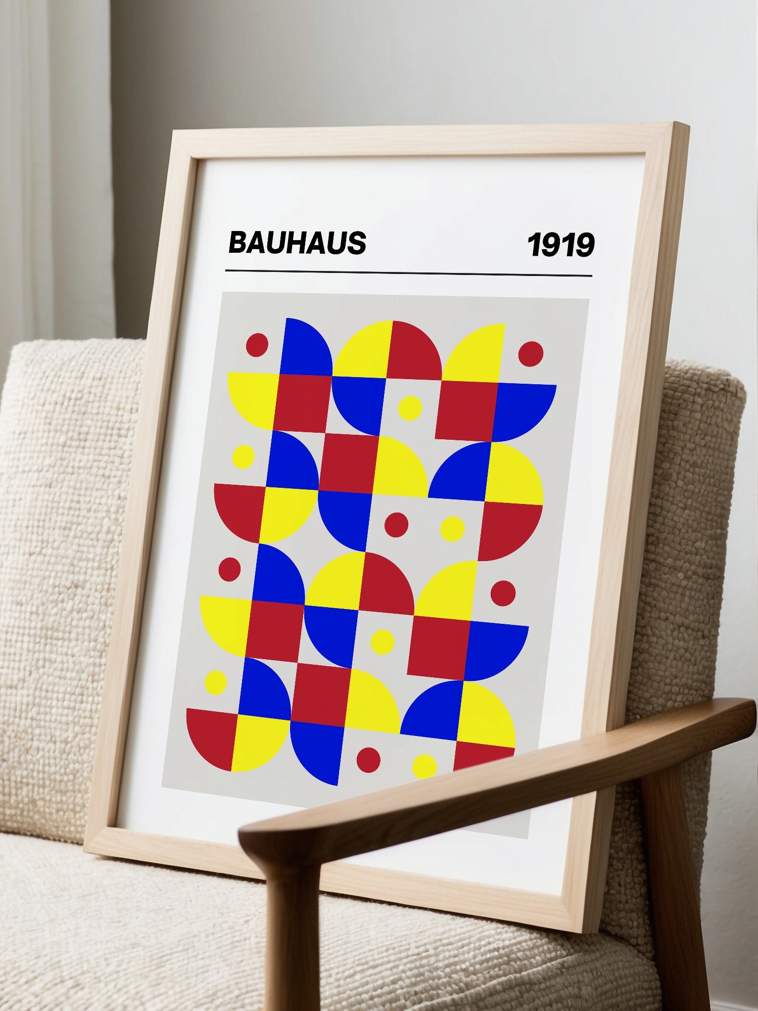 Bauhaus geometric wall art with red blue yellow grid pattern, semicircular, displayed in modern living room setting