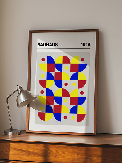 Bauhaus geometric wall art with red blue yellow grid pattern, semicircular, displayed in modern living room setting
