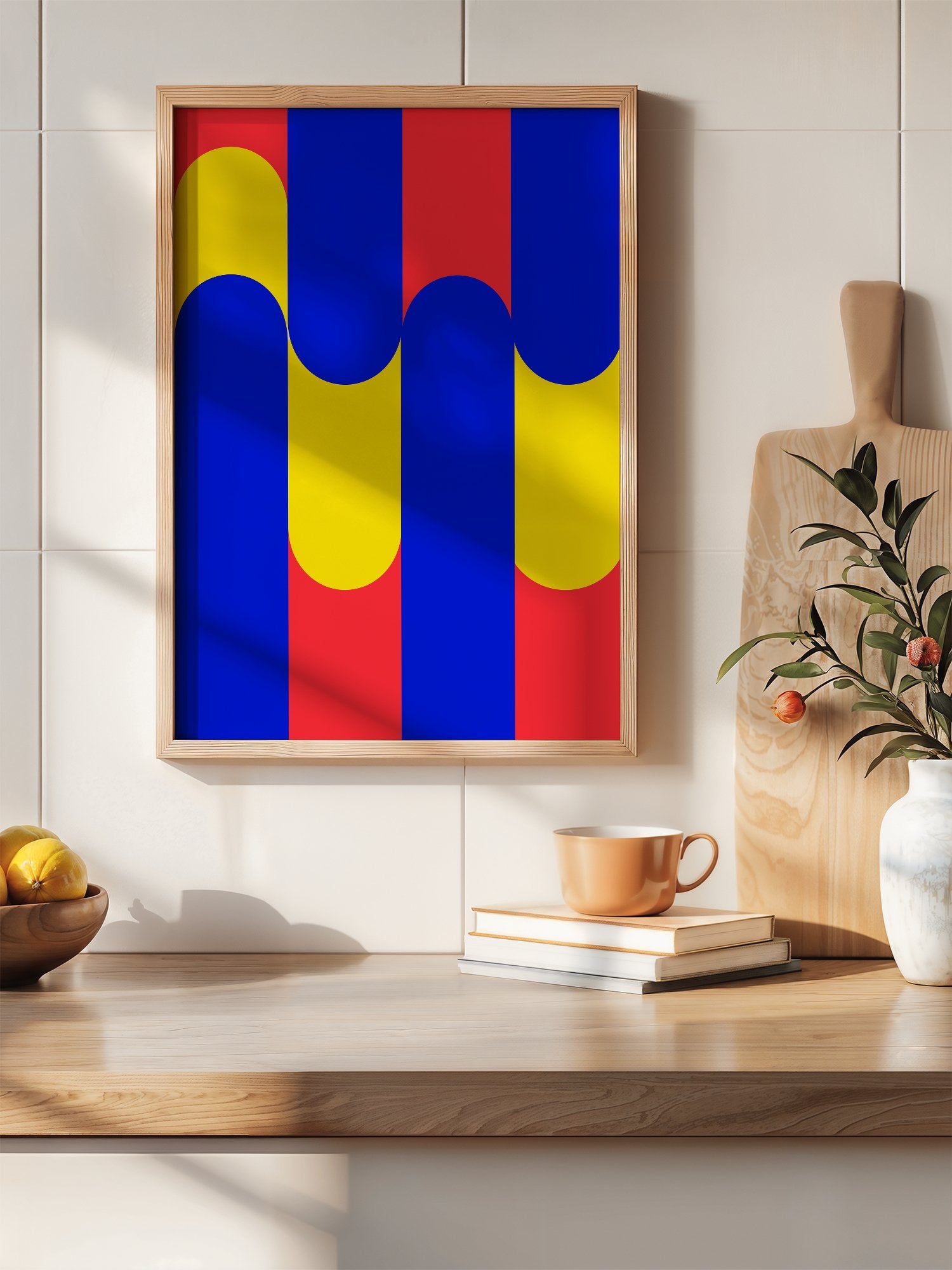 Geometric abstract art print with blue circles on yellow rounded rectangles, hanging in contemporary bedroom interior