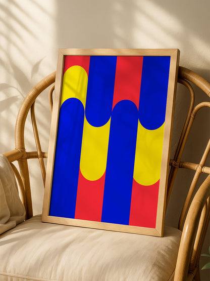 Geometric abstract art print with blue circles on yellow rounded rectangles, shown in minimalist home office space