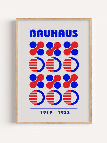 Bauhaus geometric poster featuring blue and red circles and semicircles in grid, close-up showing print texture and color ...