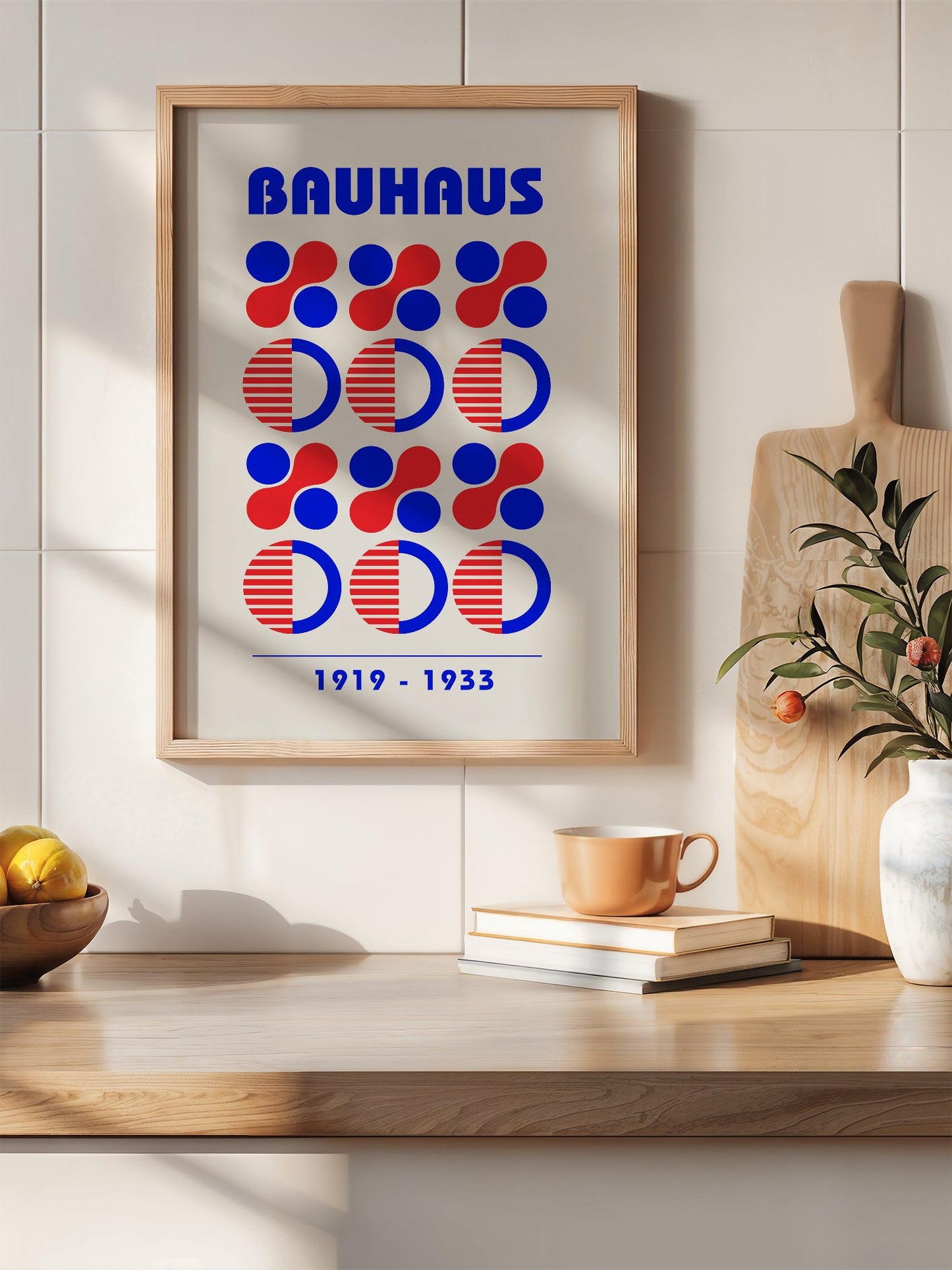 Bauhaus geometric poster featuring blue and red circles and semicircles in grid, hanging in contemporary bedroom interior