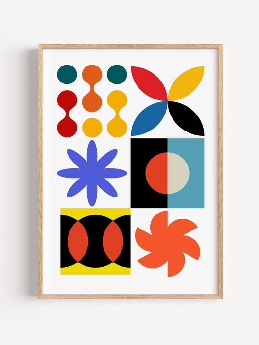 Colourful geometric abstract art print with starbursts, circles and shapes in, close-up showing print texture and color de...