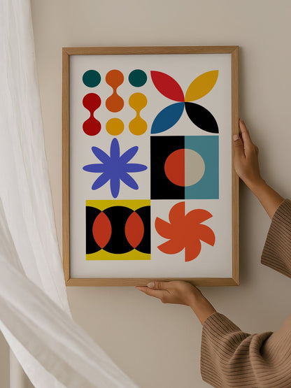 Colourful geometric abstract art print with starbursts, circles and shapes in, hanging in contemporary bedroom interior