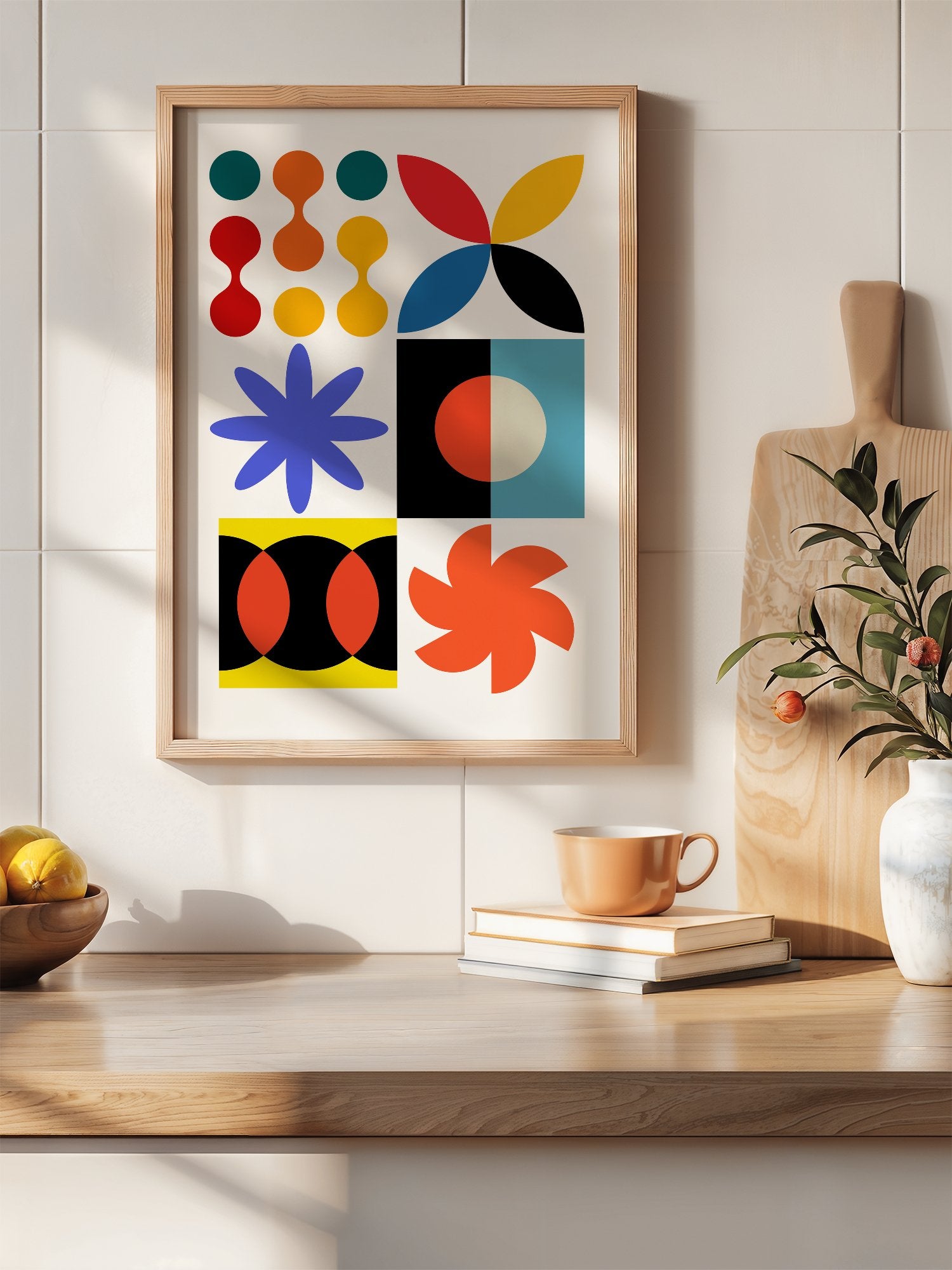 Colourful geometric abstract art print with starbursts, circles and shapes in, hanging in contemporary bedroom interior