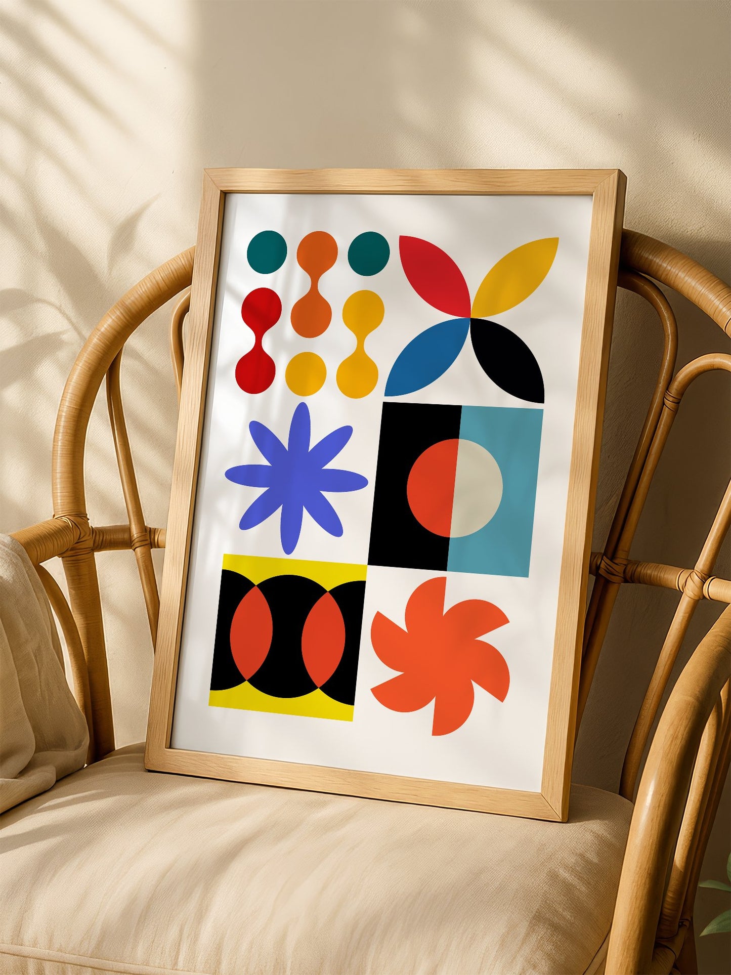 Colourful geometric abstract art print with starbursts, circles and shapes in, shown in minimalist home office space