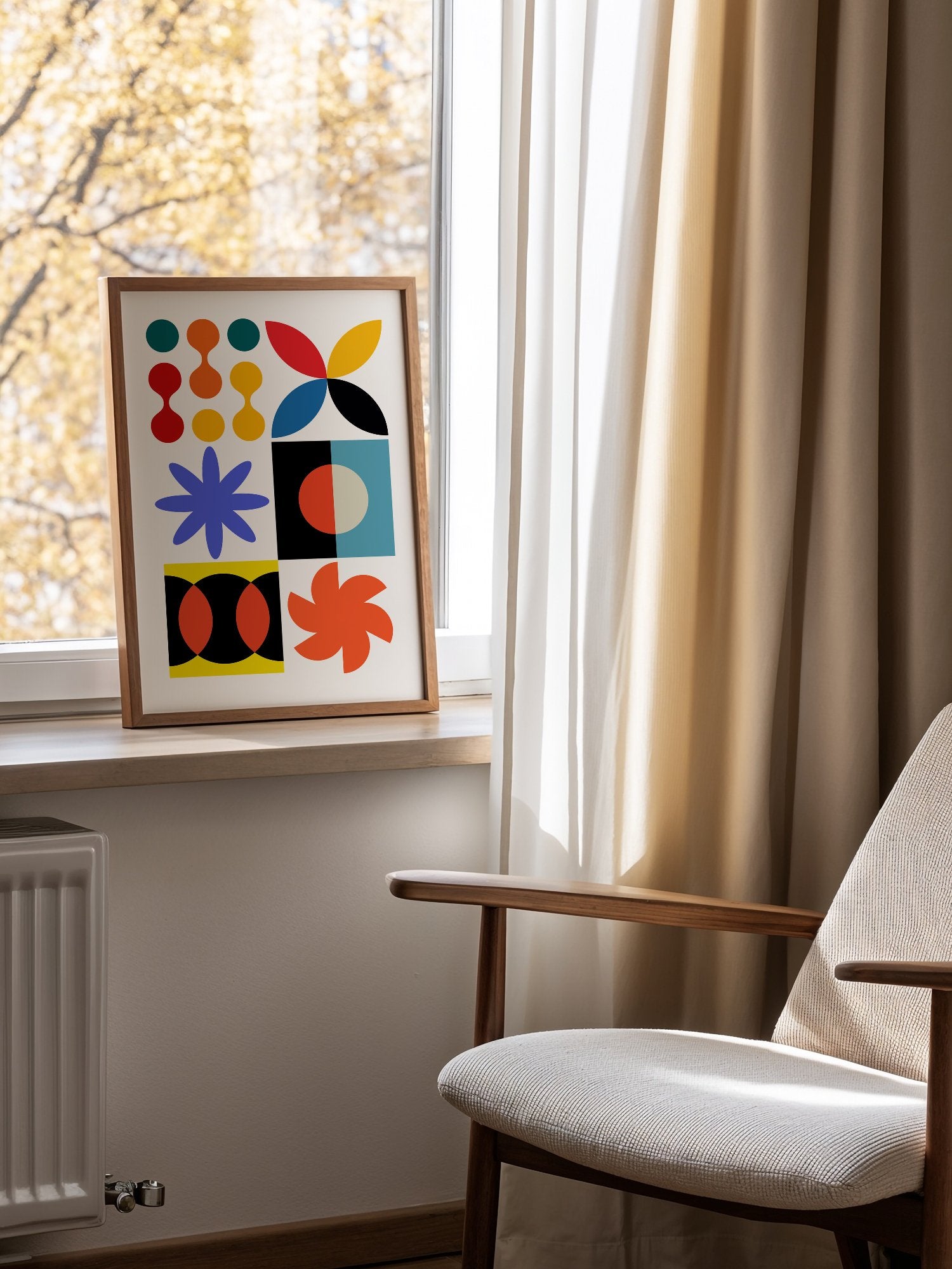 Colourful geometric abstract art print with starbursts, circles and shapes in, mounted in bright gallery wall arrangement