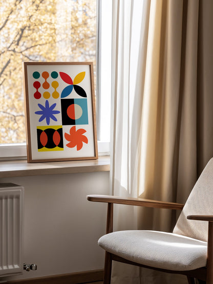 Colourful geometric abstract art print with starbursts, circles and shapes in, mounted in bright gallery wall arrangement