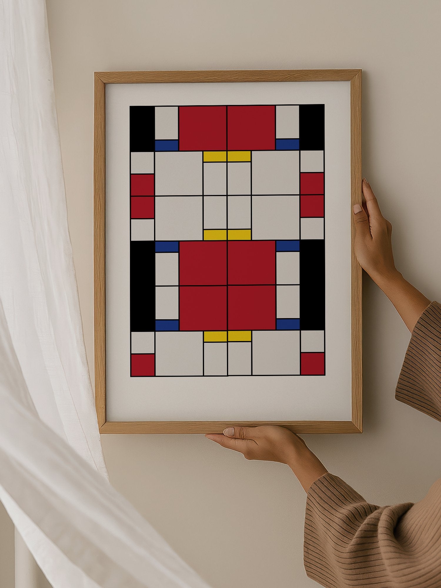 Bauhaus geometric abstract art print with red white and blue rectangular blocks, hanging in contemporary bedroom interior