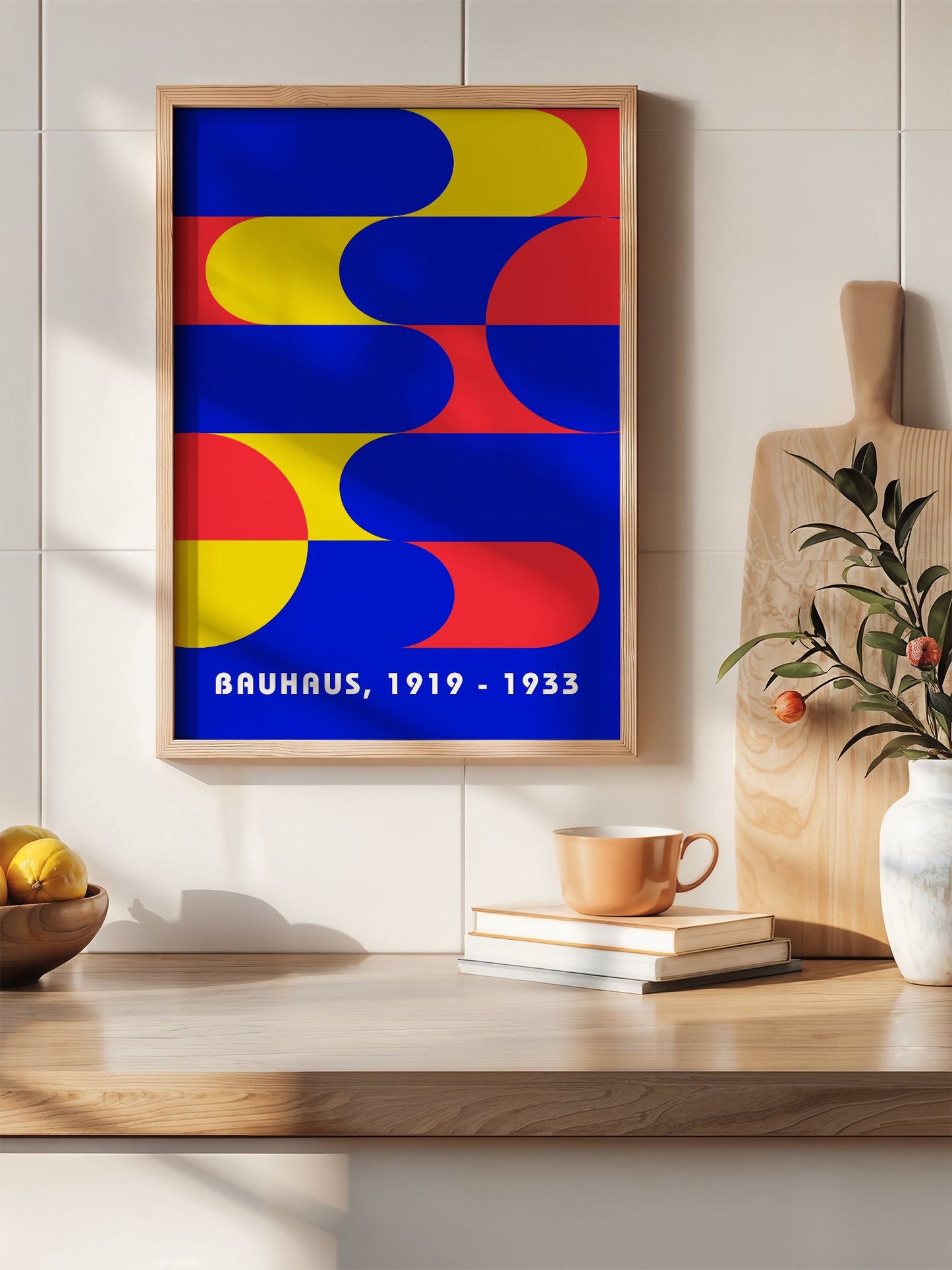 Bauhaus geometric abstract poster with interlocking blue yellow and red shapes, hanging in contemporary bedroom interior