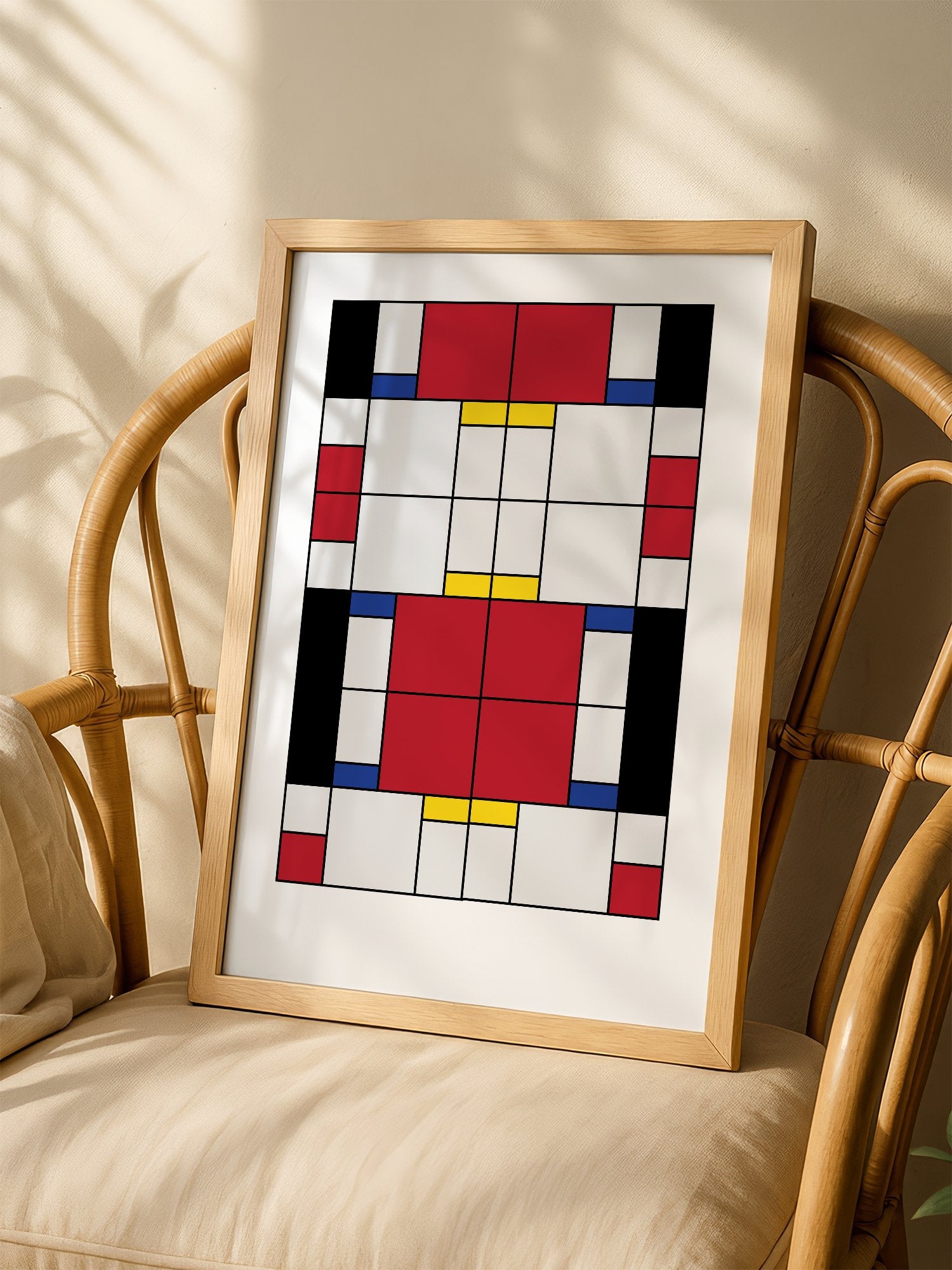 Bauhaus geometric abstract art print with red white and blue rectangular blocks, shown in minimalist home office space