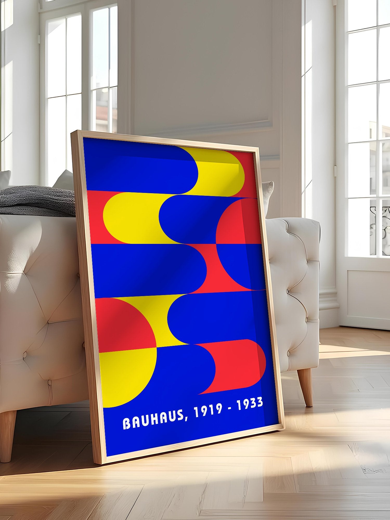 Bauhaus geometric abstract poster with interlocking blue yellow and red shapes, featured in stylish apartment decor
